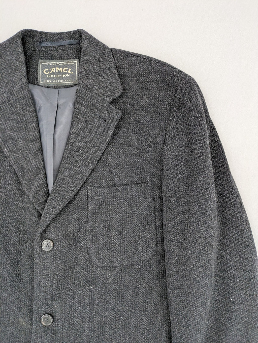 Camel Collection grey blazer three-button front with patch pockets, made from wool blend.
