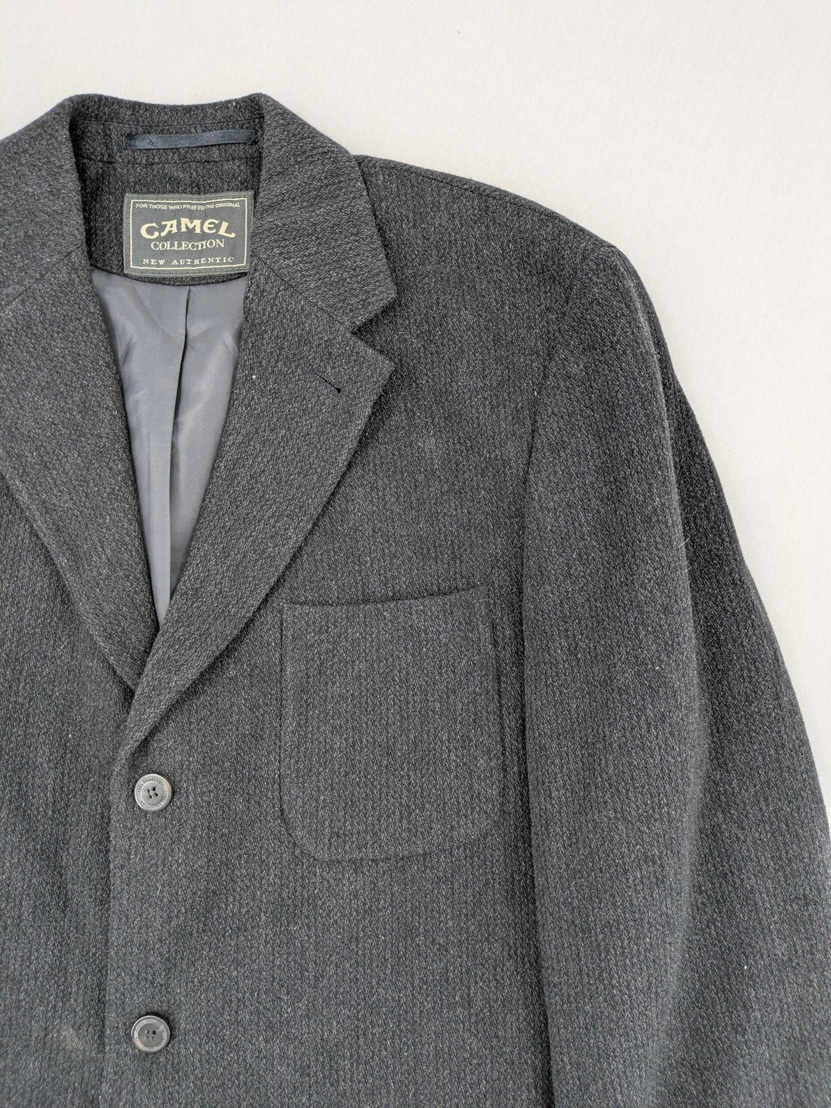 Camel Collection grey blazer three-button front with patch pockets, made from wool blend.