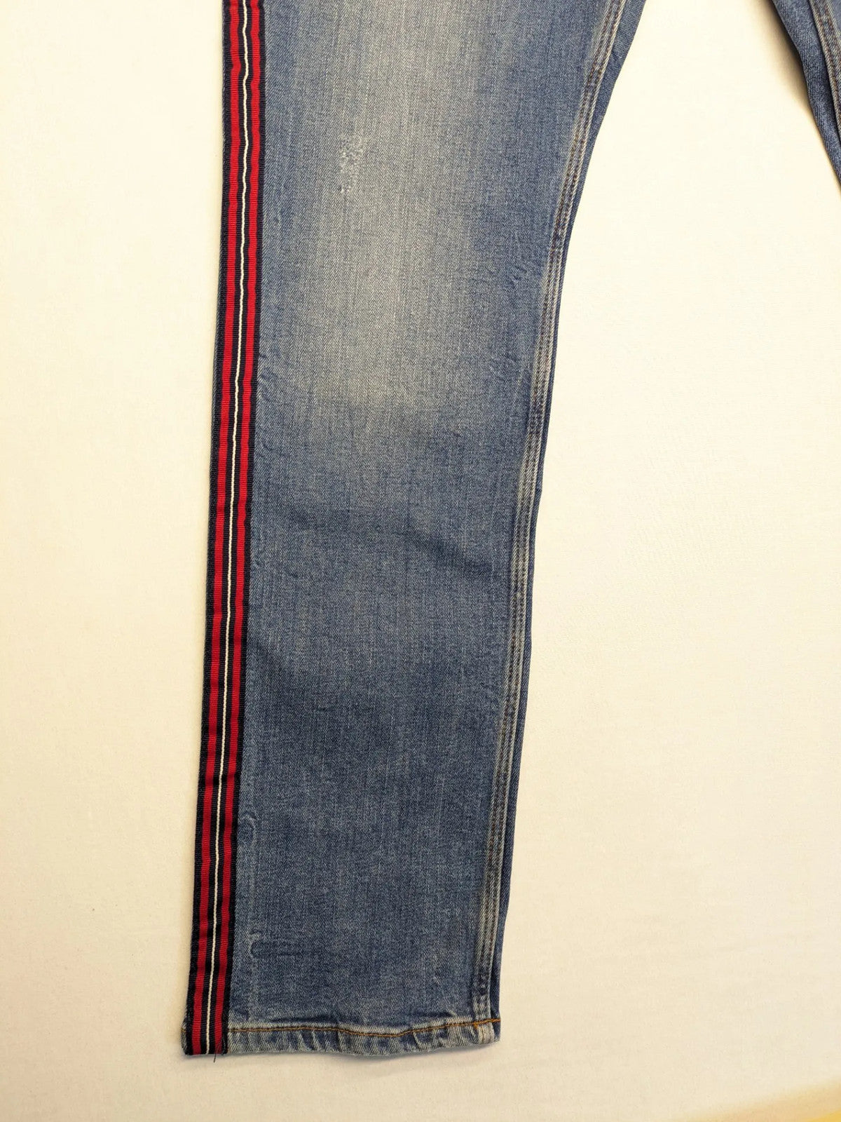 s.Oliver blue straight jeans with red and white side stripes, soft cotton blend material