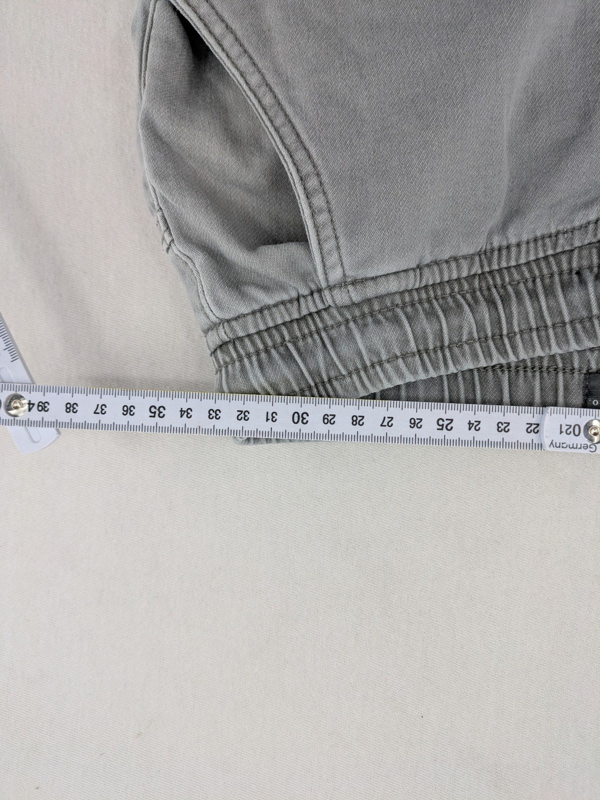 Denim & Co. grey jogger jeans with elastic waistband and ankle cuffs, cotton material.