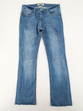 Tally Weijl blue bootcut jeans with distressed knees and raw hem detail.