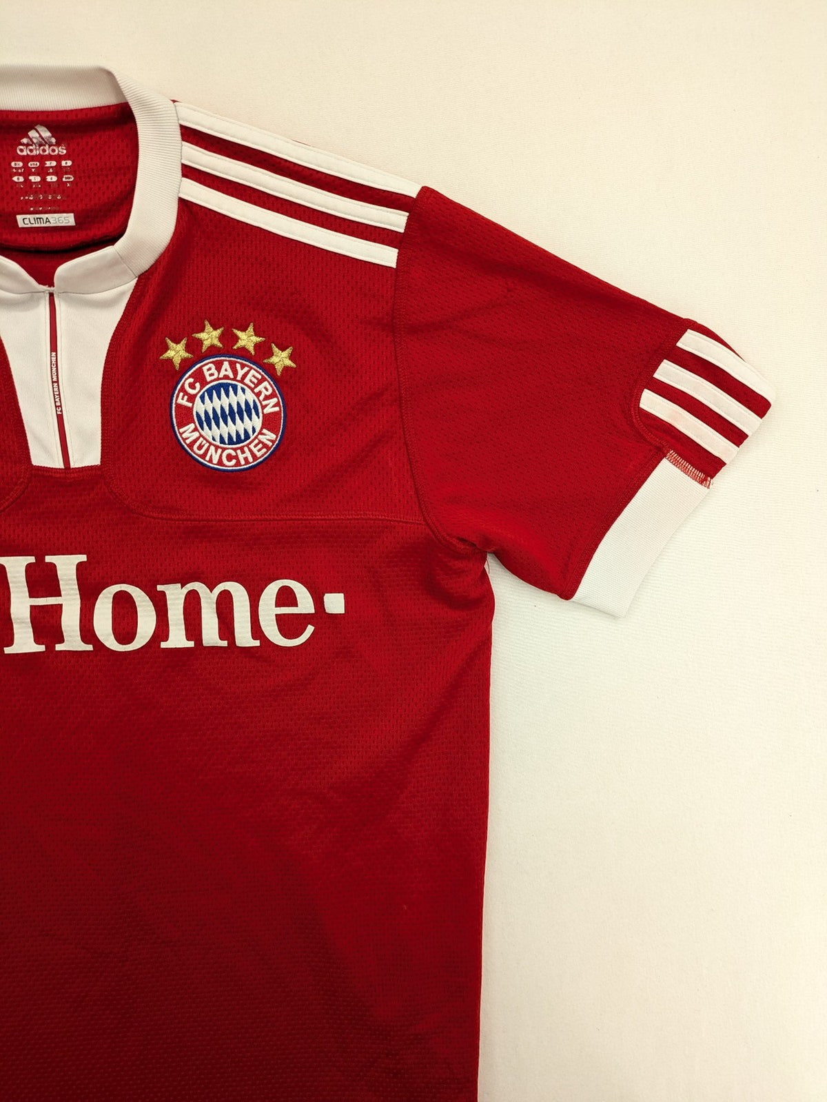 Adidas red soccer uniform with T-Home logo and embroidered FC Bayern München crest.