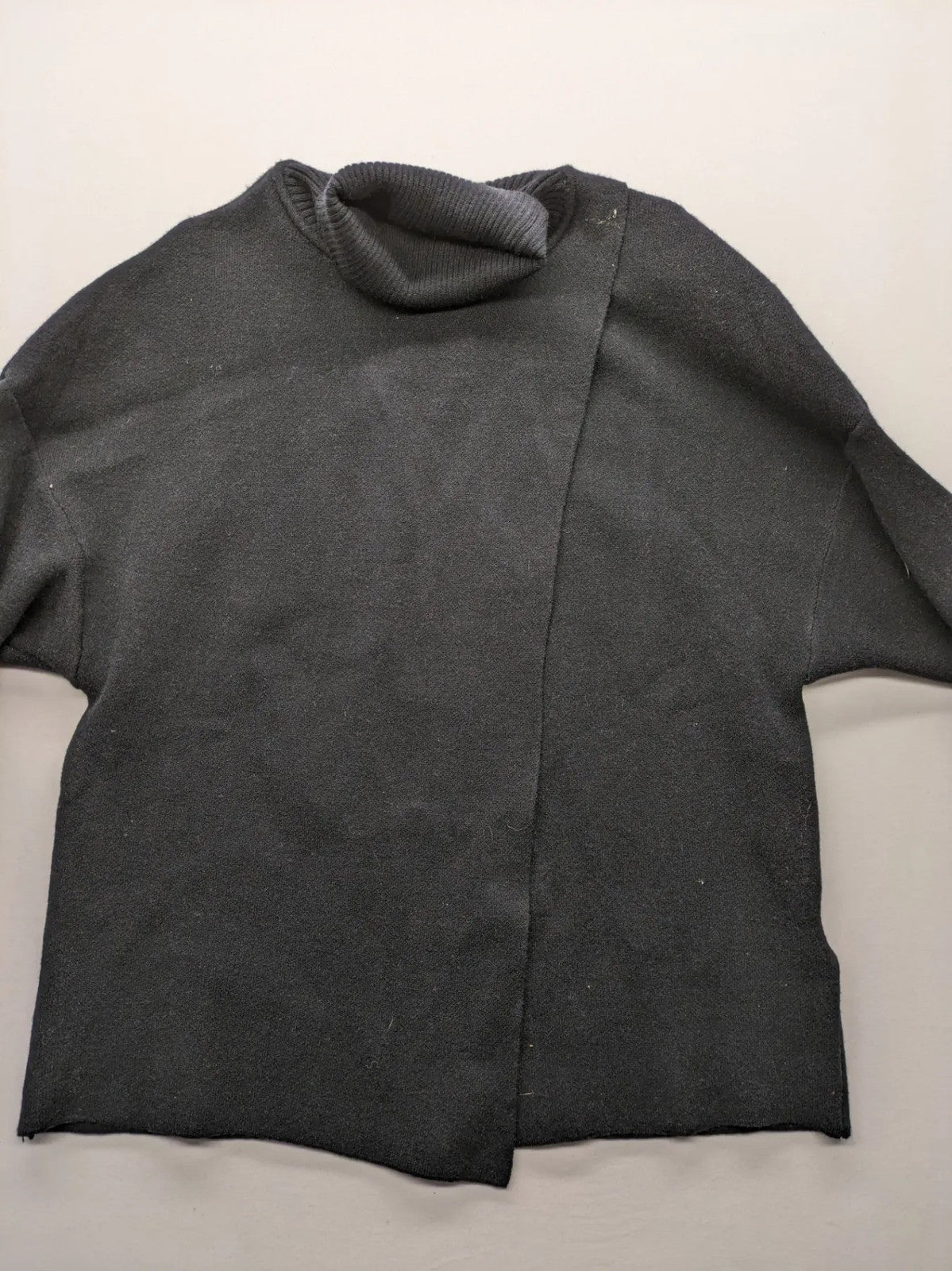 In Shape grey turtle neck jumper asymmetrical design, soft viscose blend material.
