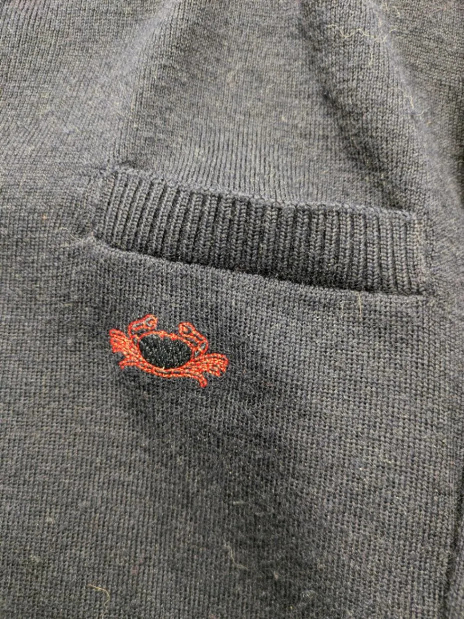 Il Granchio grey turtle neck jumper with red accents and embroidered crab logo.