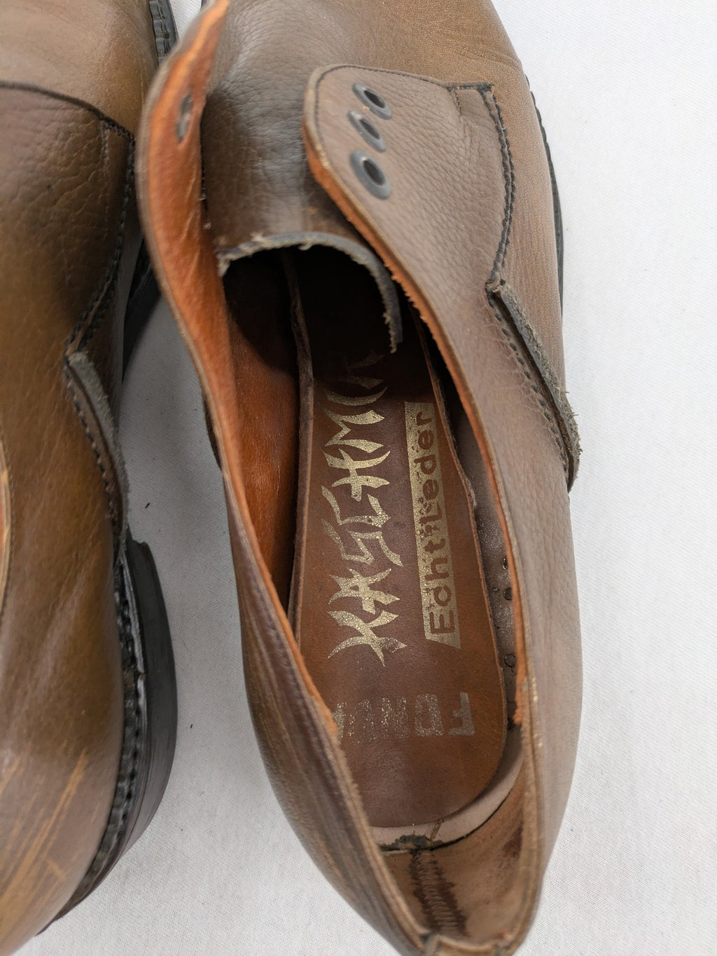 Fonda brown deck shoes genuine leather square toe design with decorative stitching.