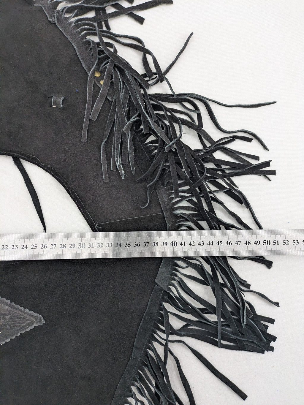Stars & Stripes black suede fringe vest with silver conchos and beaded tassels.