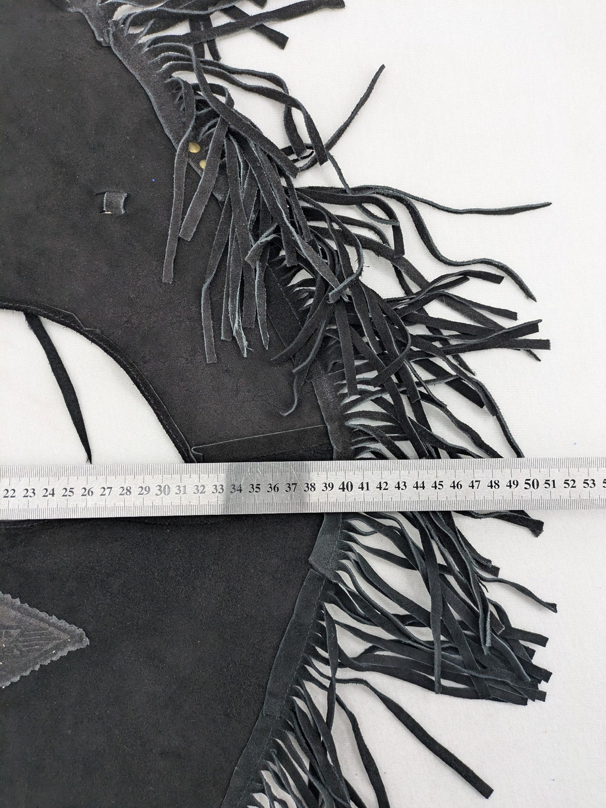 Stars & Stripes black suede fringe vest with silver conchos and beaded tassels.