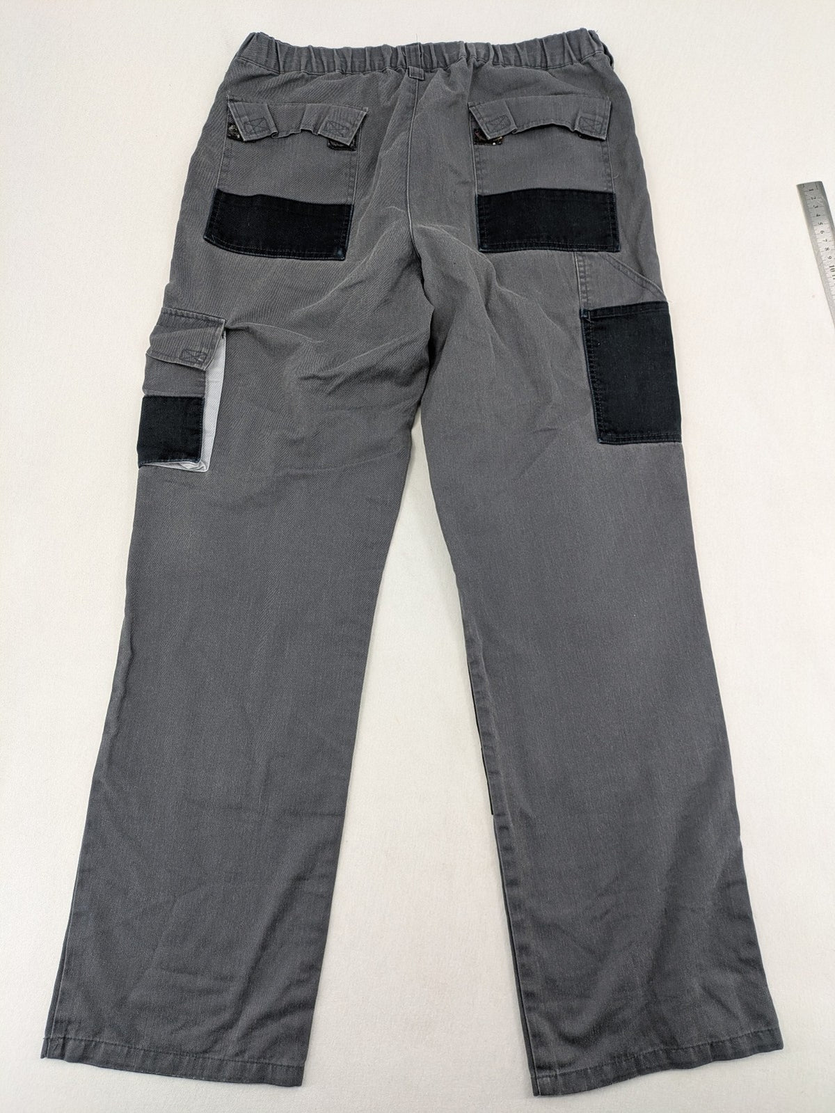 Watsons grey and black hunting tactical pants with Cordura reinforcements and elastic waistband.