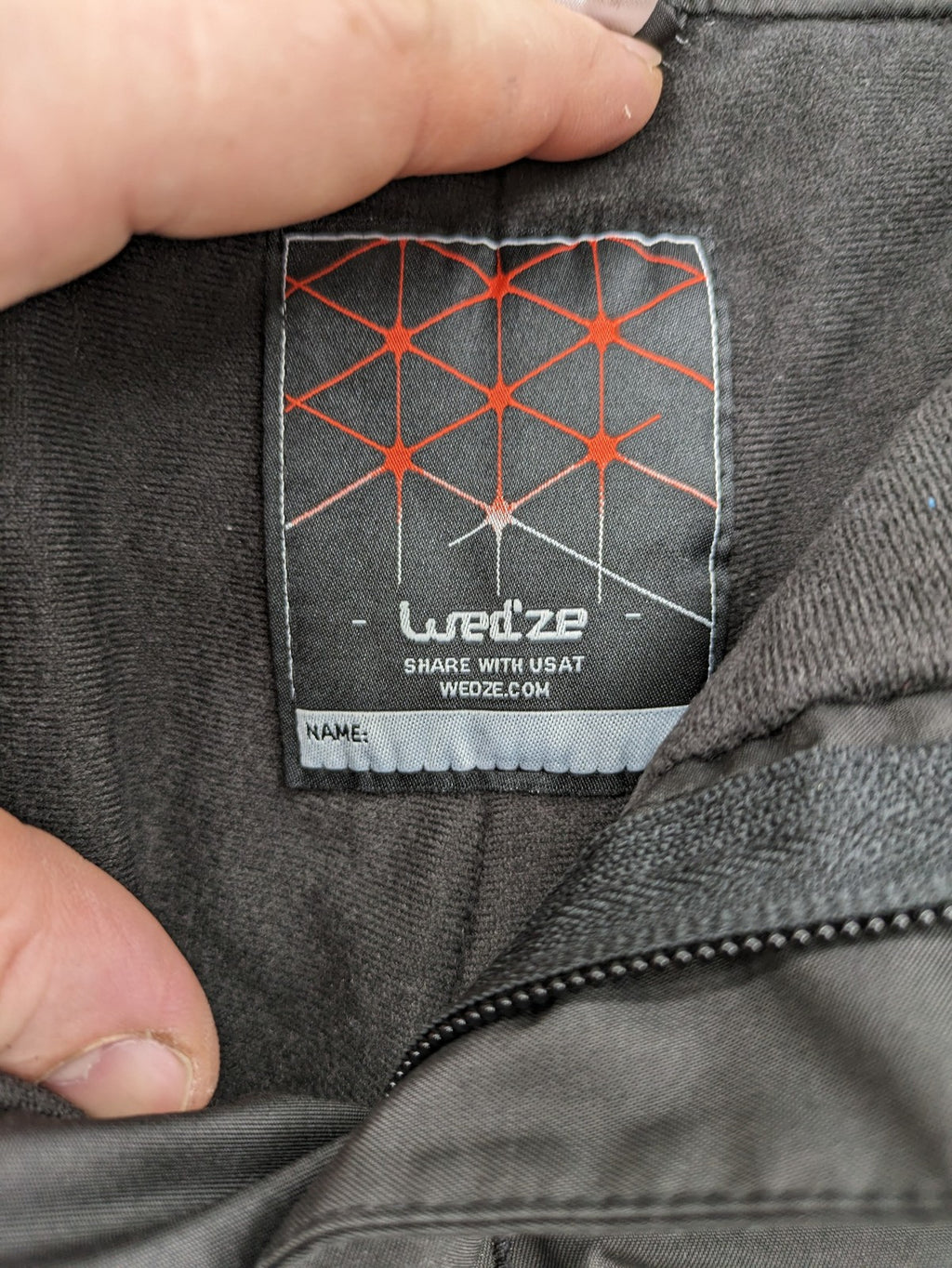Wed'ze black ski pants with adjustable waistband, zip pockets, and Pull'n'Fit system.