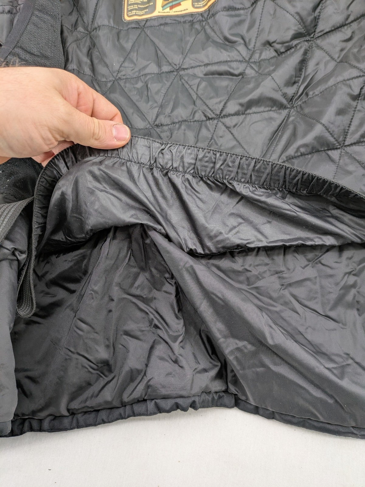 Icepeak black and white ski snowboard jacket with RECCO logo and quilted insulation.