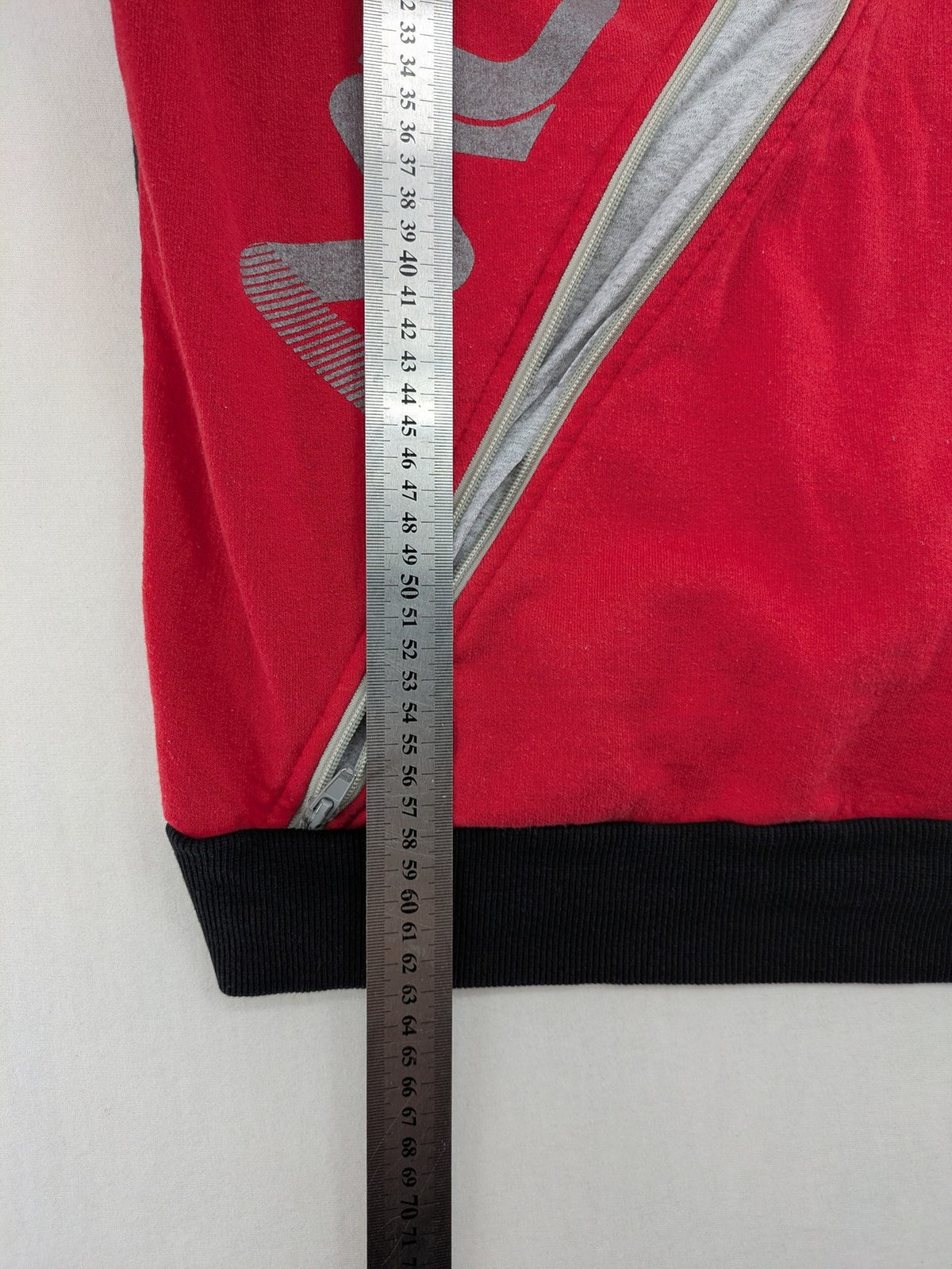Boystar vintage turtle neck jumper red black colorblock with "MUST FREE YOUR BODY" graphic.