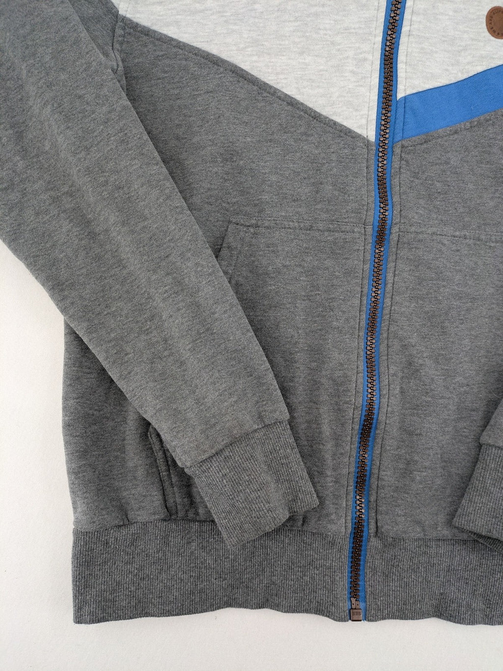 ALIFE turtle neck jumper blue grey colorblock design with logo details and soft cotton blend.