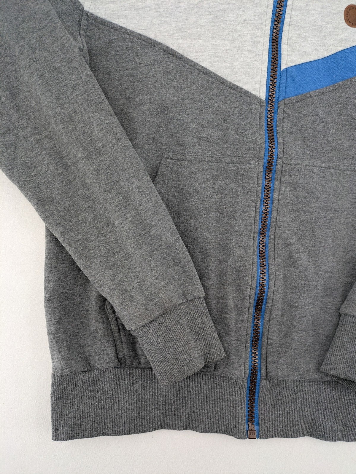 ALIFE turtle neck jumper blue grey colorblock design with logo details and soft cotton blend.