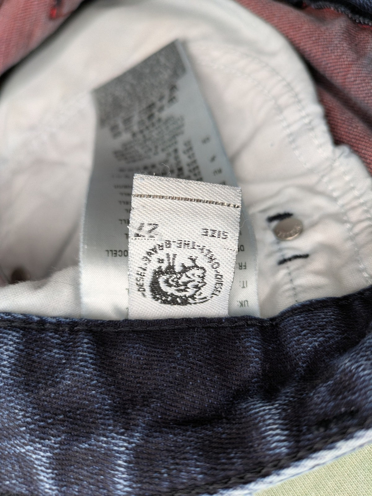 Diesel blue boyfriend jeans low waist dark wash stretch denim with logo patch.