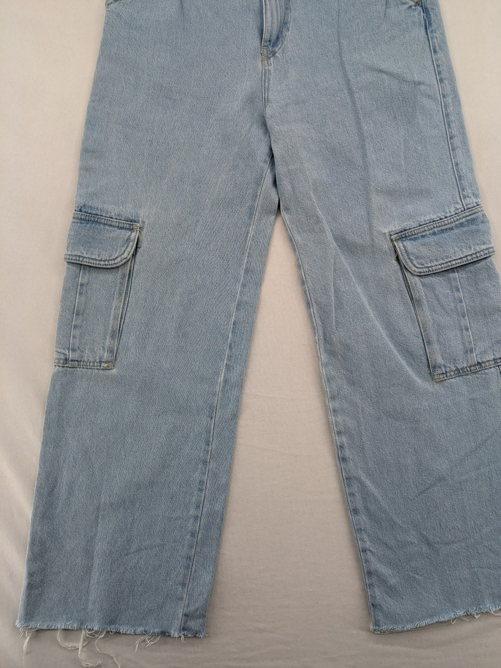 MNG blue straight jeans with cargo pockets and raw hem, high waist denim.