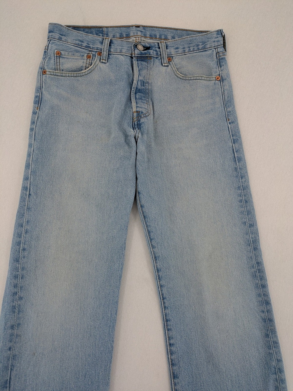 Levi's blue straight jeans light wash denim with button fly and classic fit.