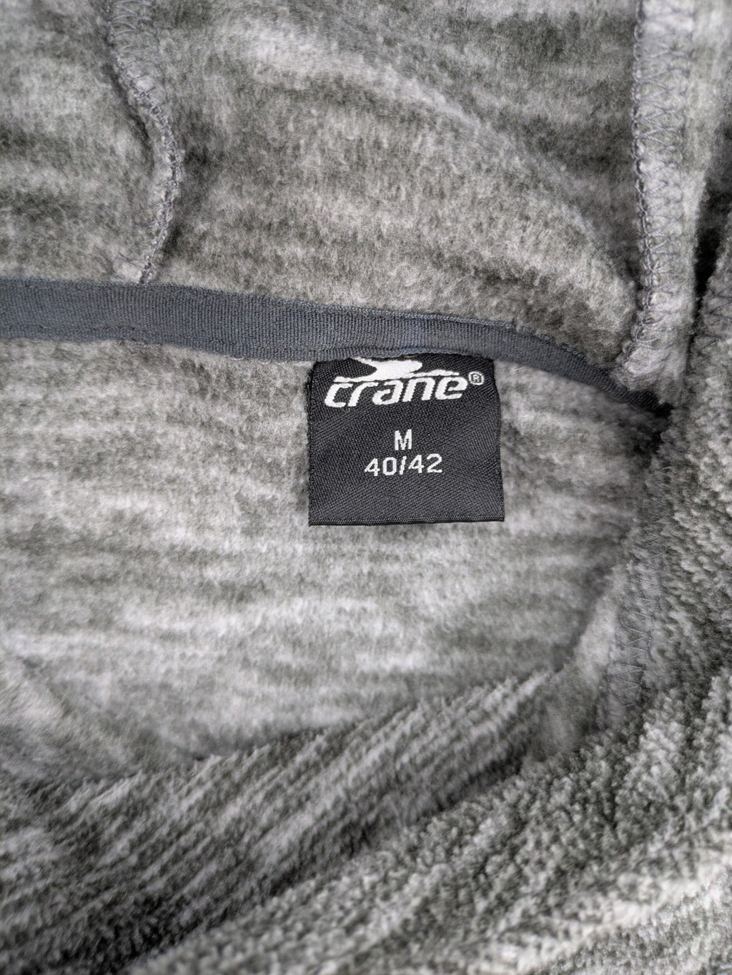 Crane grey fleece turtle neck jumper with adjustable drawstring hood and melange fabric.