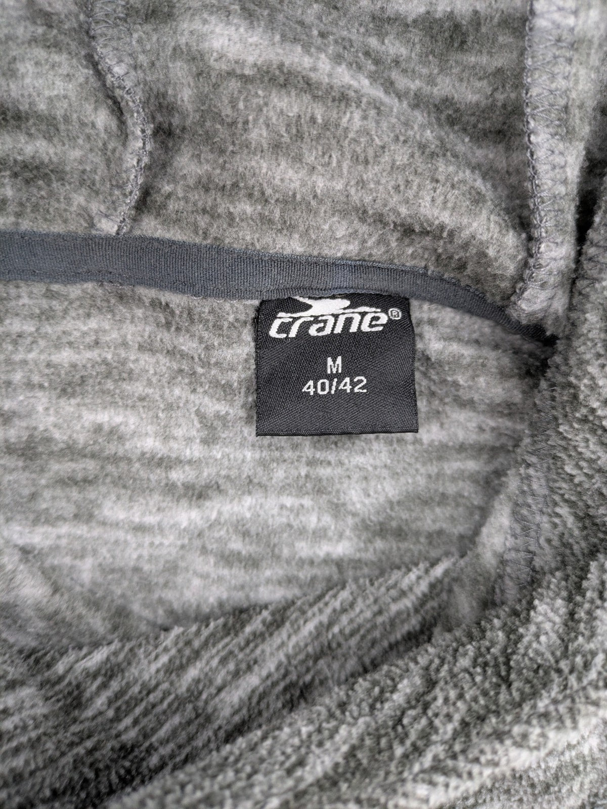 Crane grey fleece turtle neck jumper with adjustable drawstring hood and melange fabric.