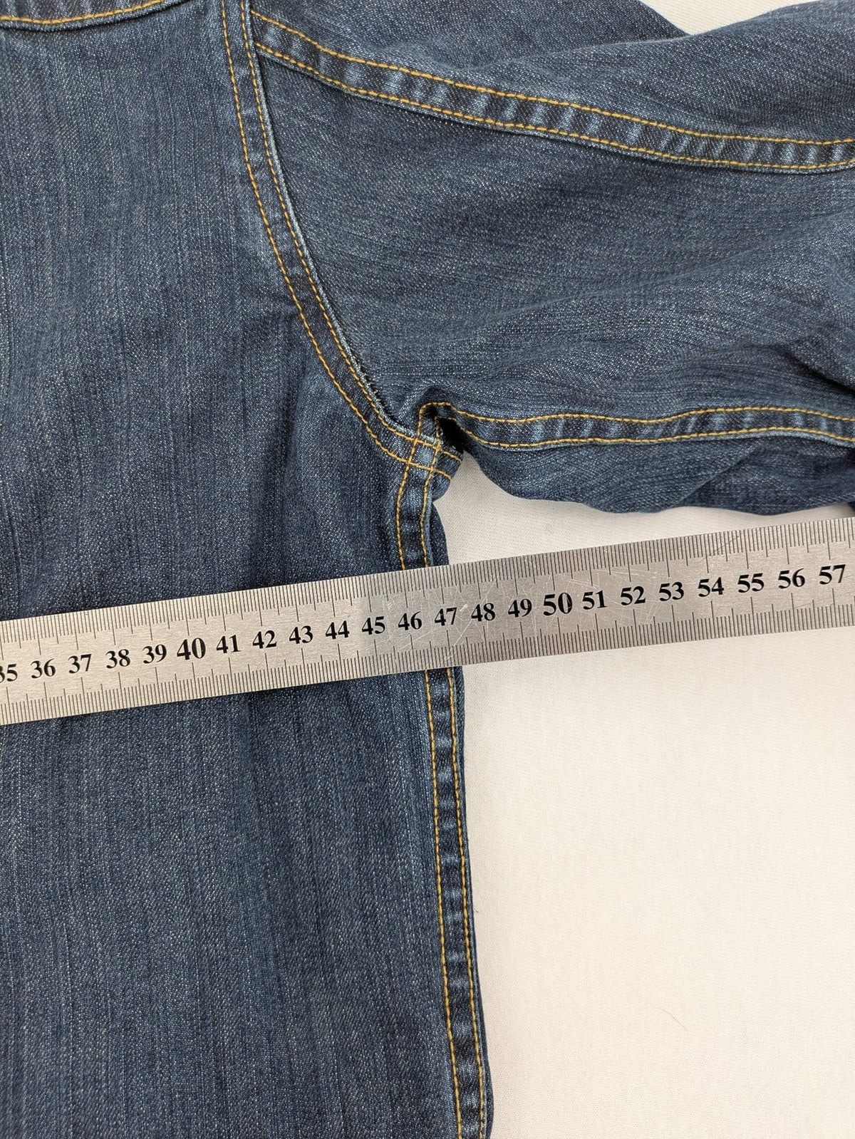 CLOSED blue denim trucker jacket with button front and two chest pockets.