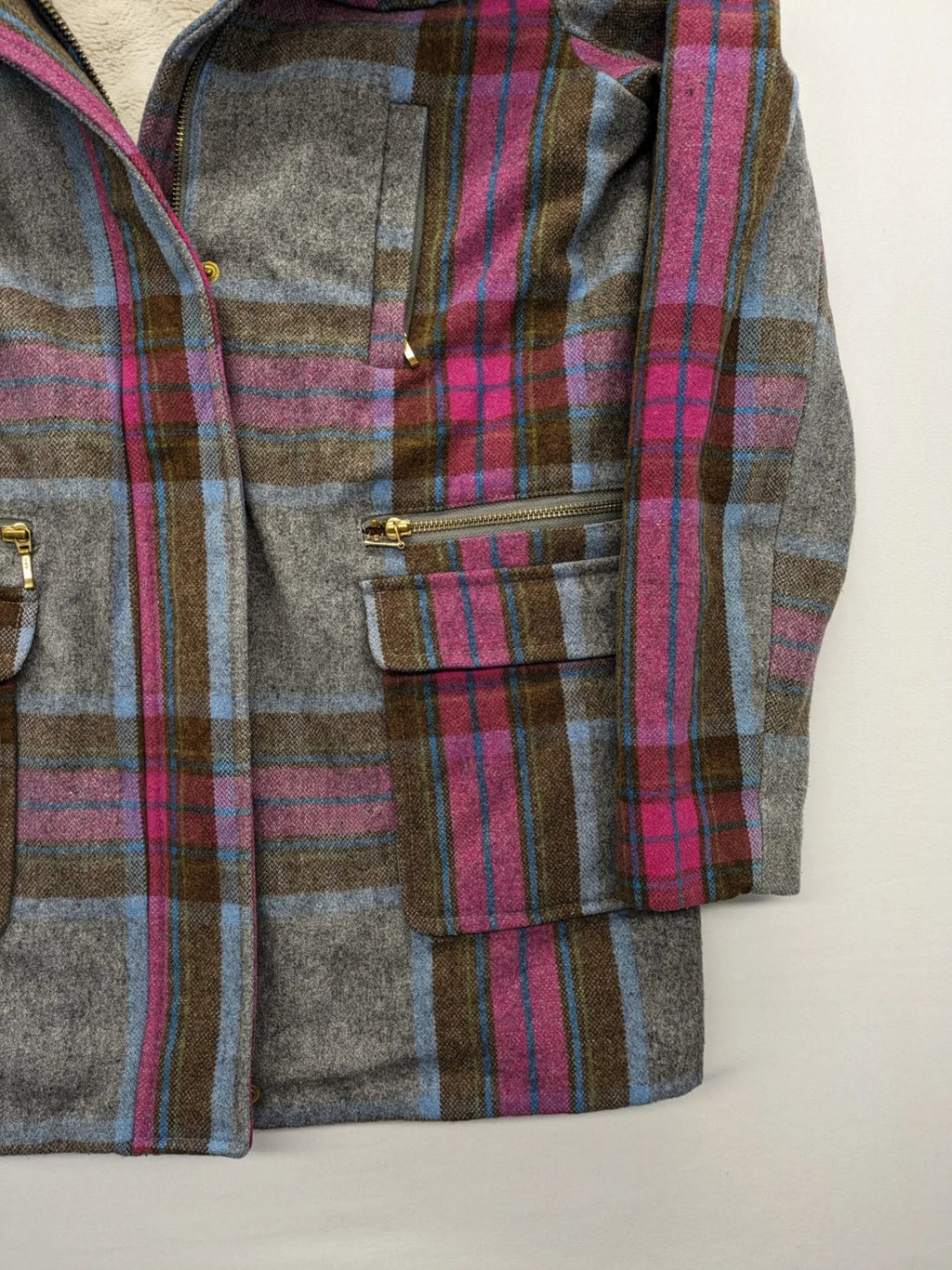 Johnnie B pink coat with gray check pattern, Sherpa lining, and zip closure.