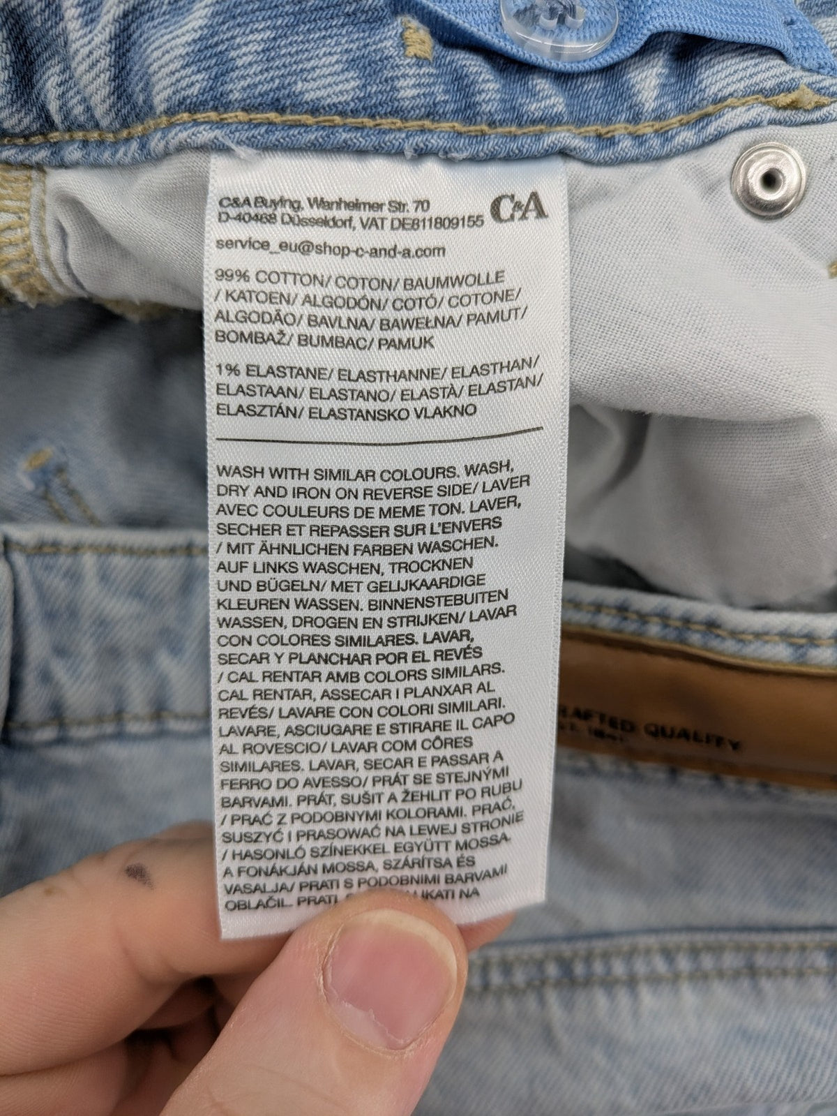 C&A blue wide leg jeans with distressed knee details and classic five-pocket design.