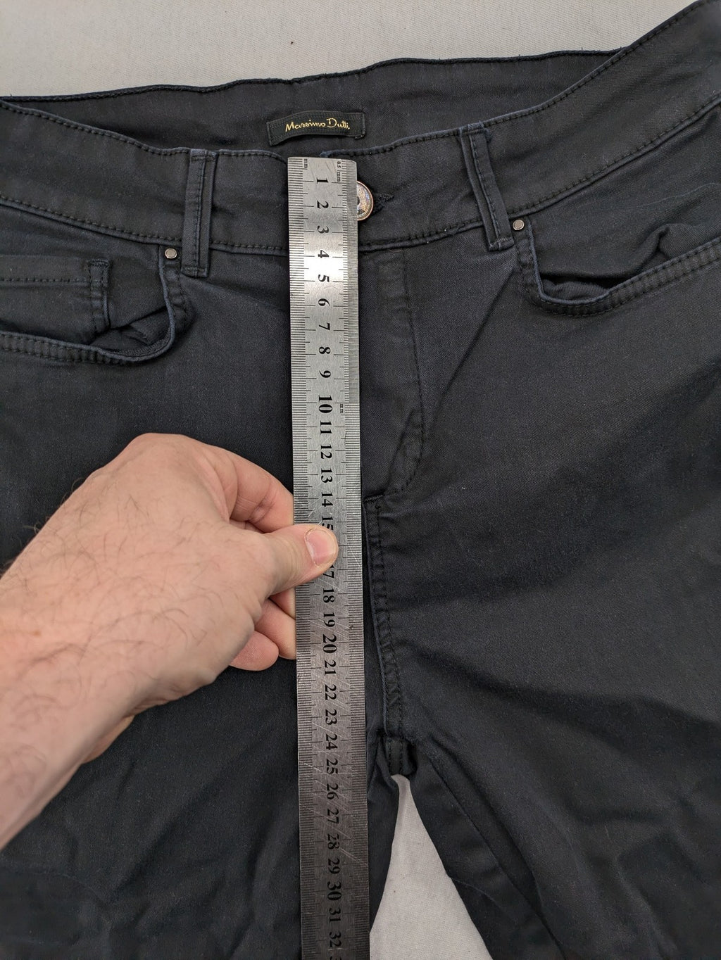Massimo Dutti grey skinny fit jeans with coated finish and sleek silhouette.