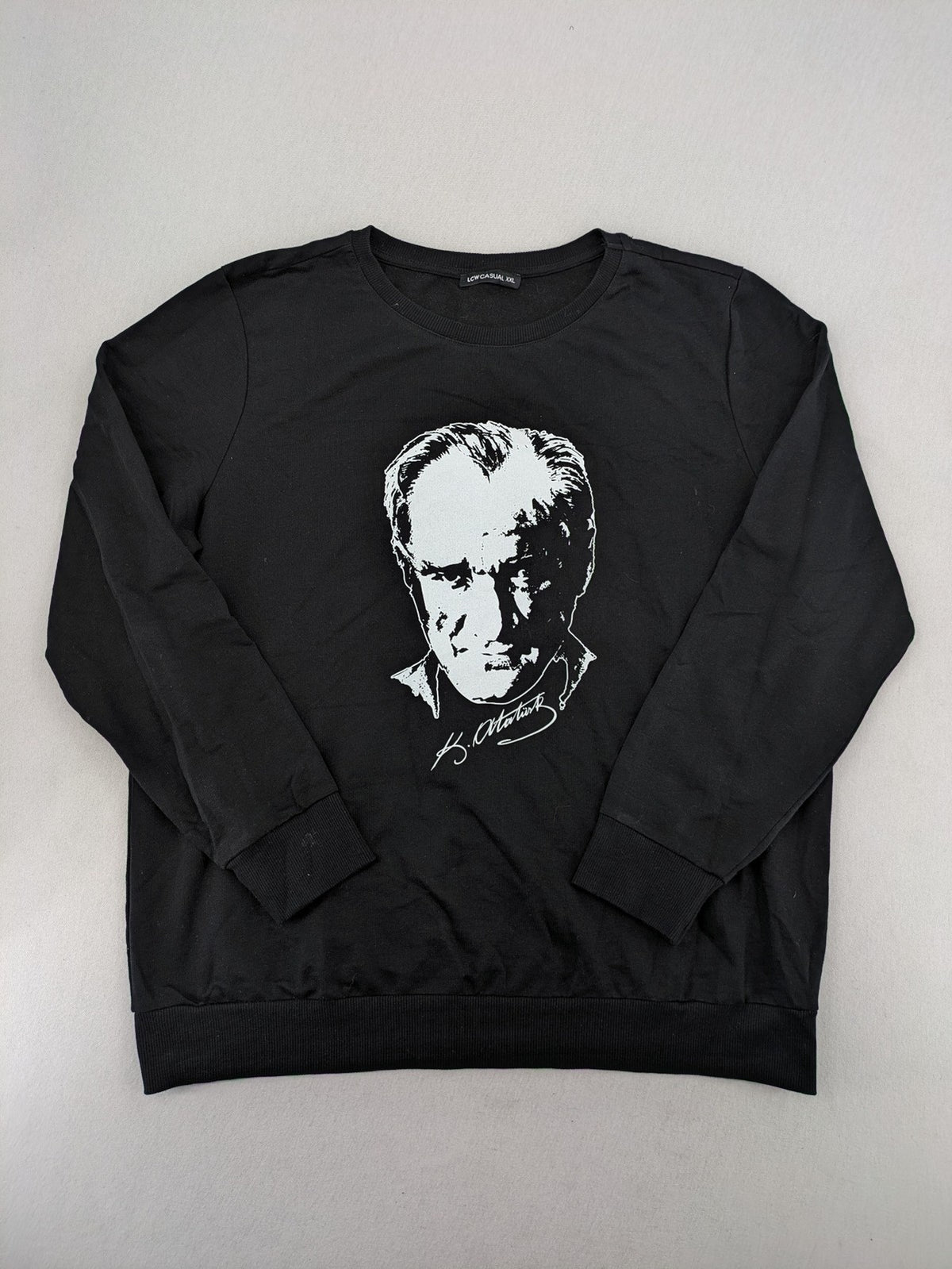 LC Waikiki black turtle neck jumper featuring Atatürk graphic print and signature.