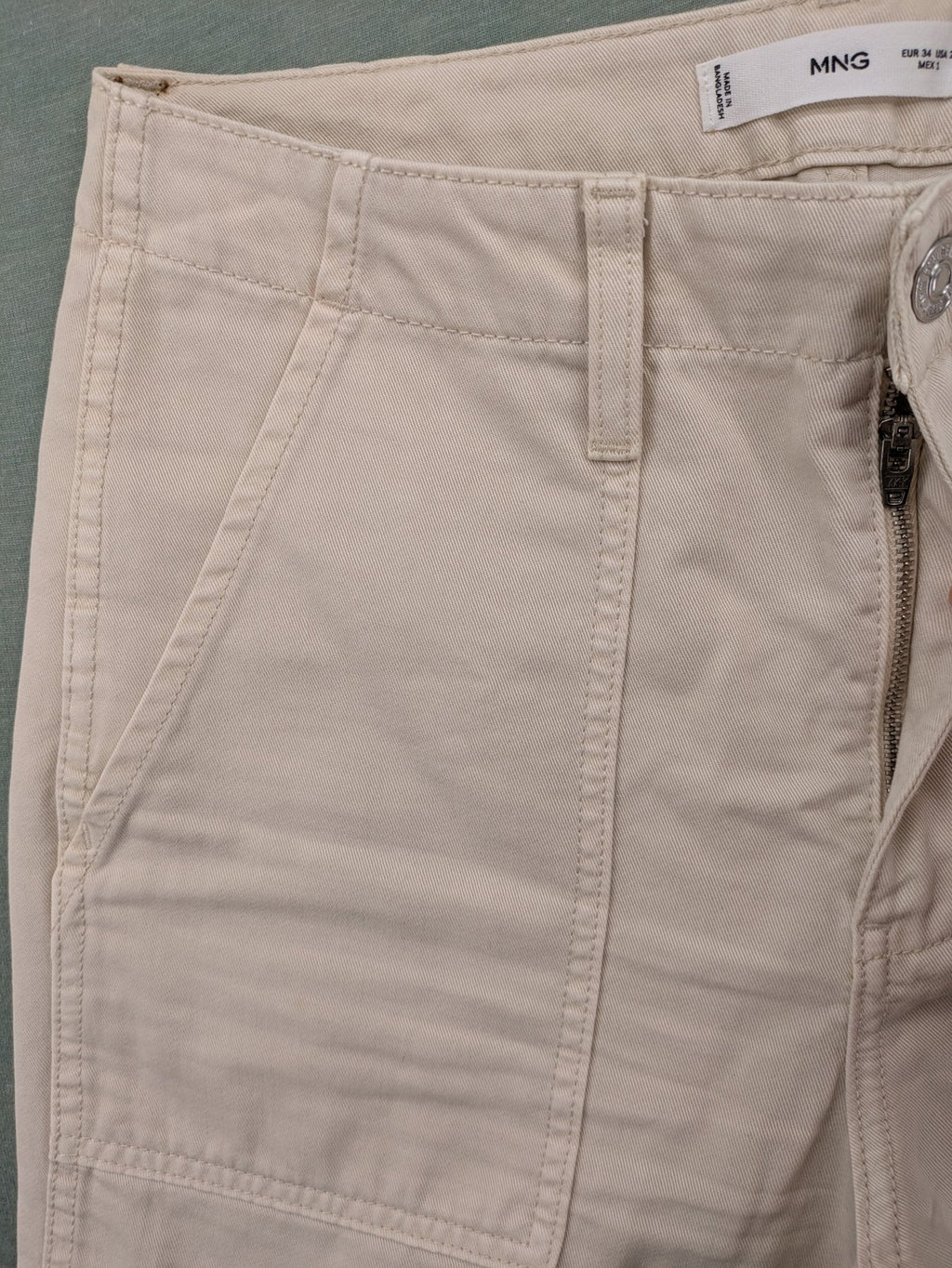 MNG beige cargo pants with straight leg, button closure, and patch pockets.