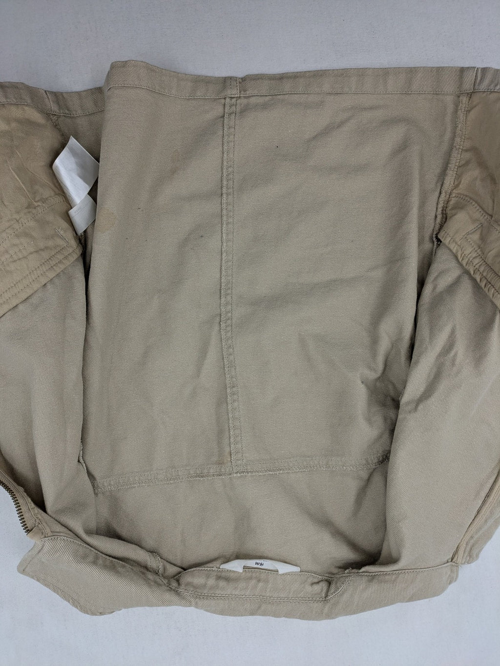 H&M beige twill coat with full zip, classic collar, and practical pockets.