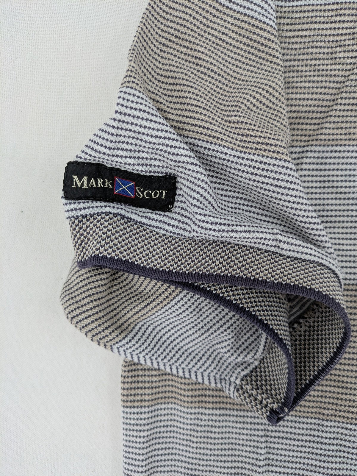 Mark Scot Collection grey and tan striped polo shirt with classic collar and logo.