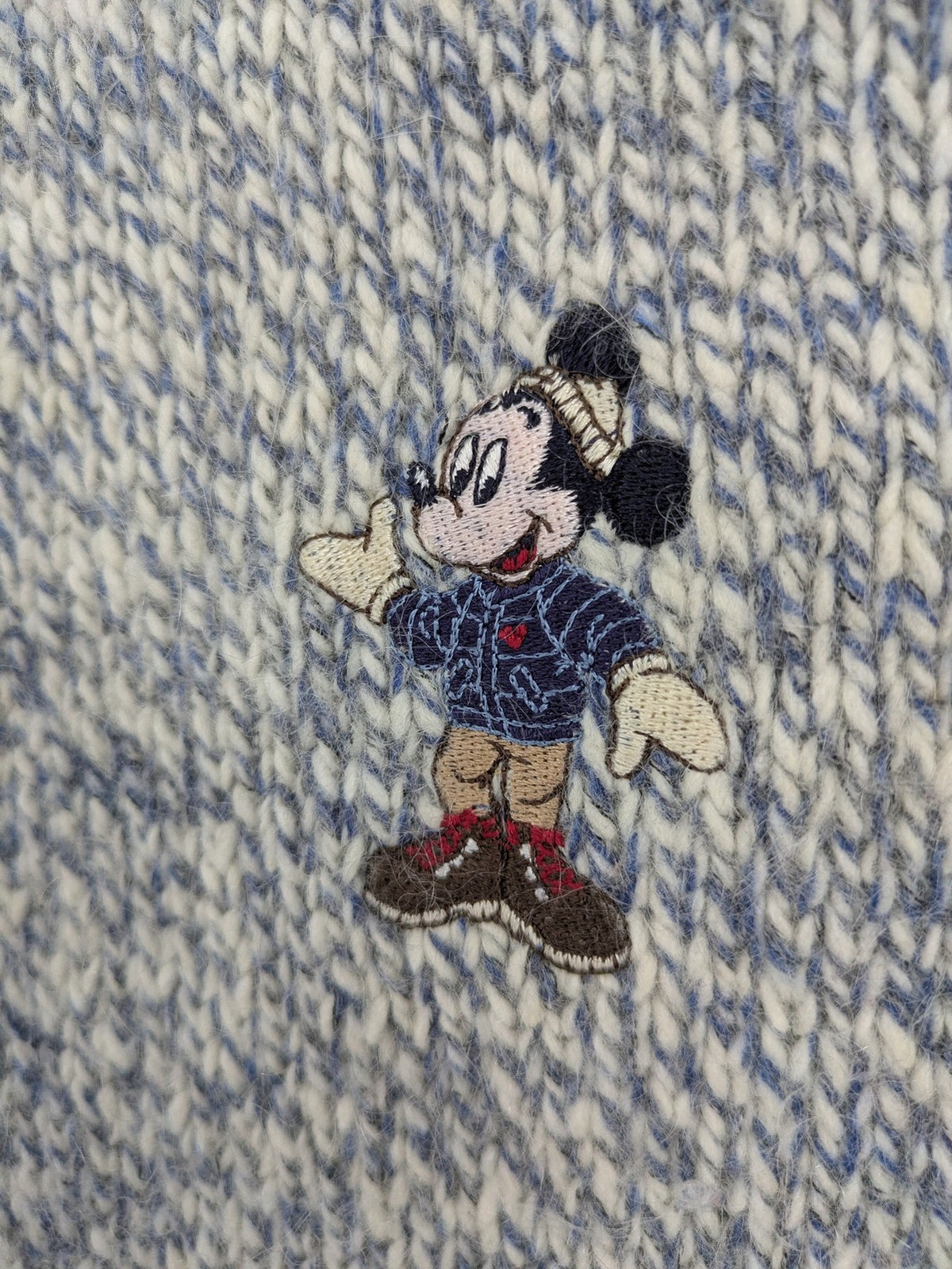 Disney blue turtle neck jumper with grey Mickey and Minnie Mouse embroidery, zip closure.