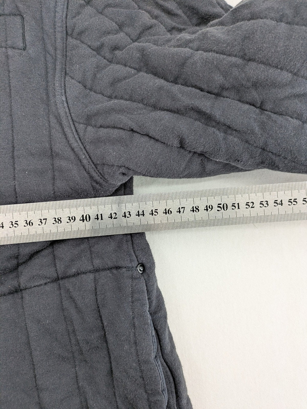 G-Star Raw grey quilted jacket with button closure and adjustable drawstring hem.
