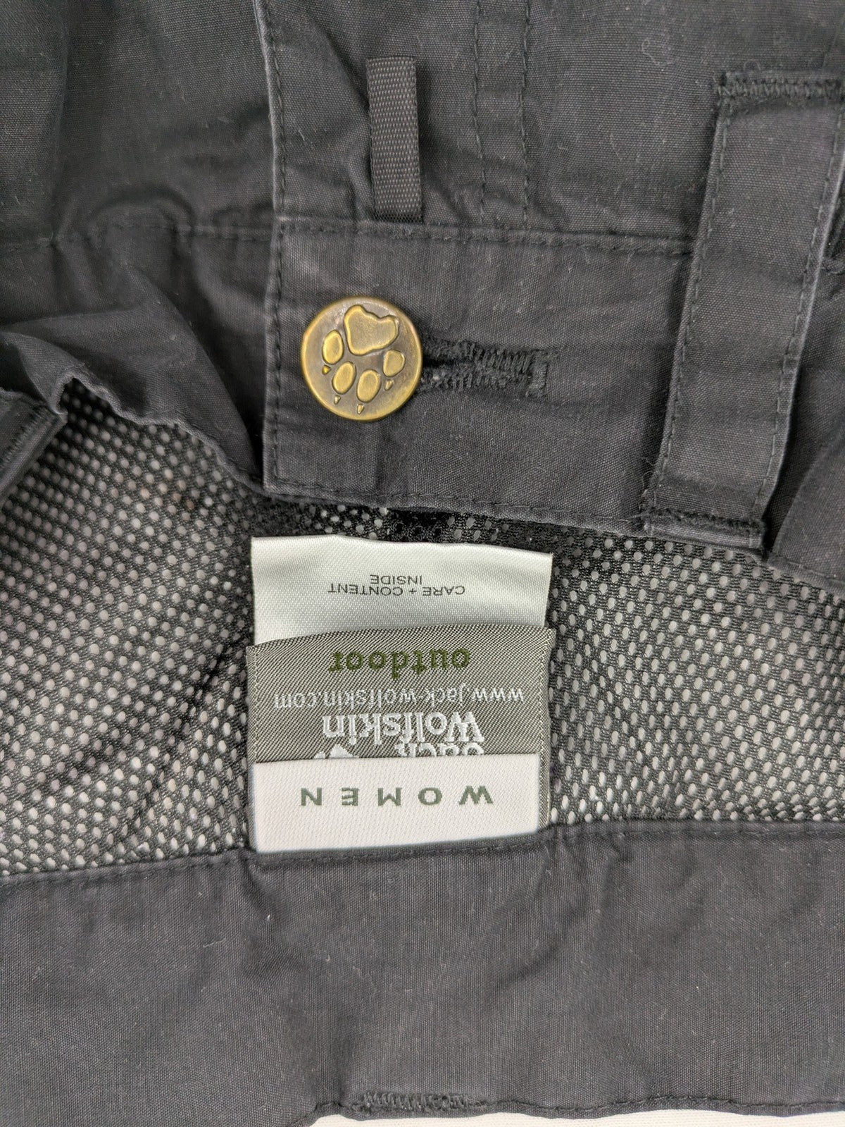 Jack Wolfskin grey outdoor pants with embroidered logo and side zip pocket.