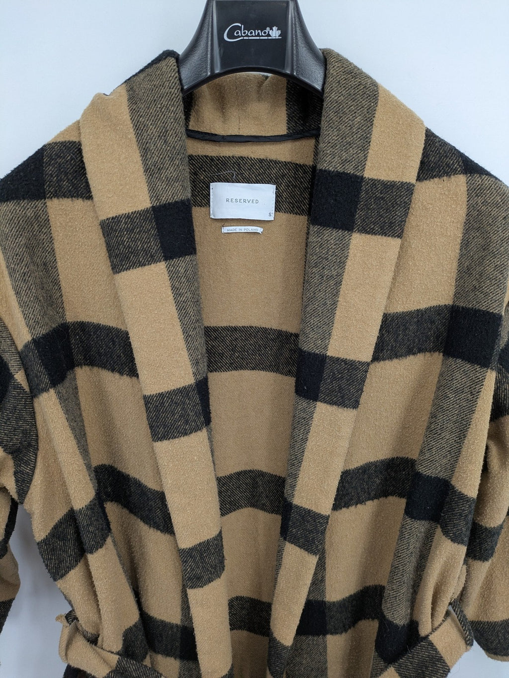 Reserved cream coat with brown and black check pattern, fringe hem, wool blend material.