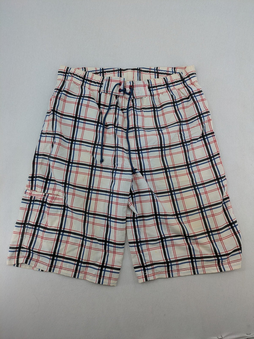 Crivit multi-coloured board shorts with classic check pattern and adjustable drawstring waistband.