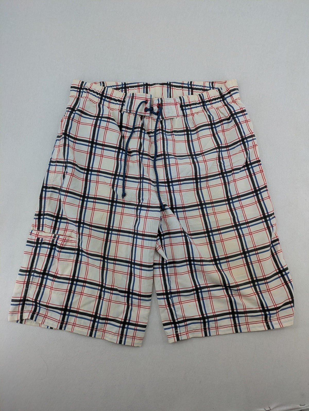 Crivit multi-coloured board shorts with classic check pattern and adjustable drawstring waistband.