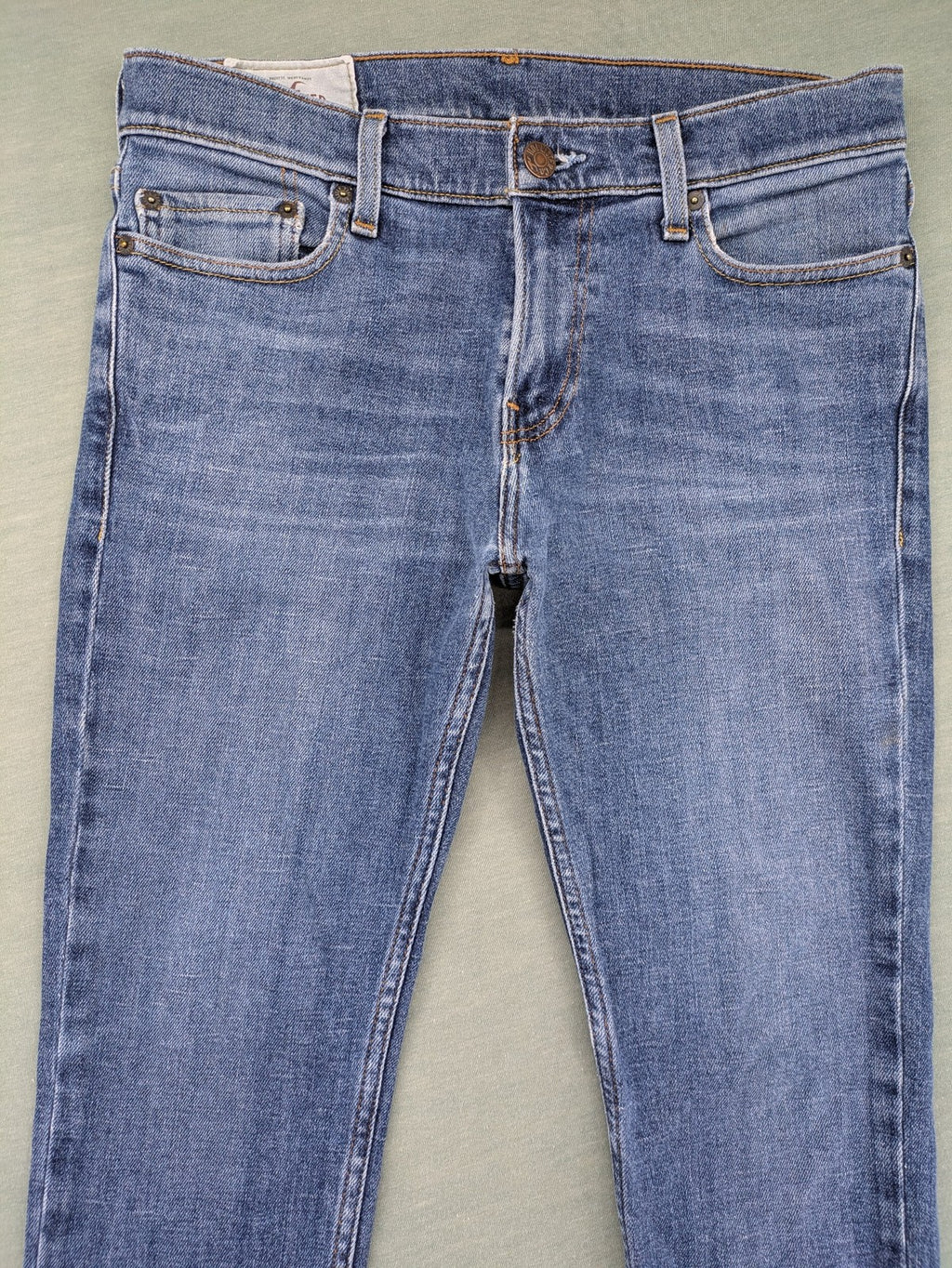 Hollister blue slim fit jeans with classic 5-pocket design and stretch denim material.