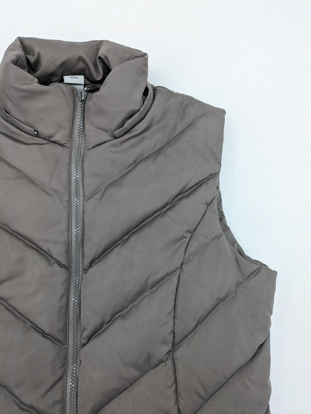 L&A Fashion grey puffer vest with zip closure, stand collar, and side pockets.