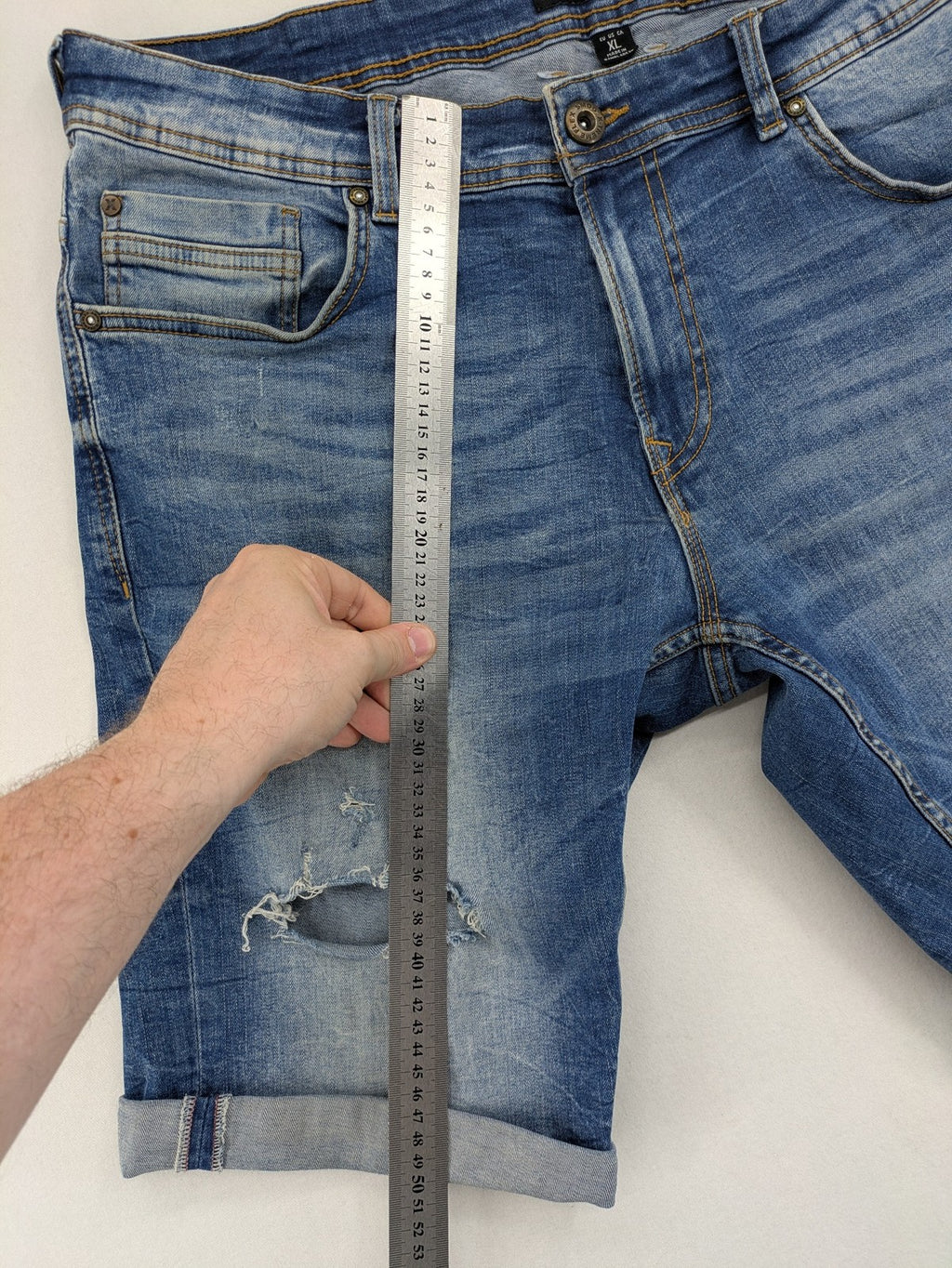 Smog blue denim shorts slim fit distressed details with rolled hem.