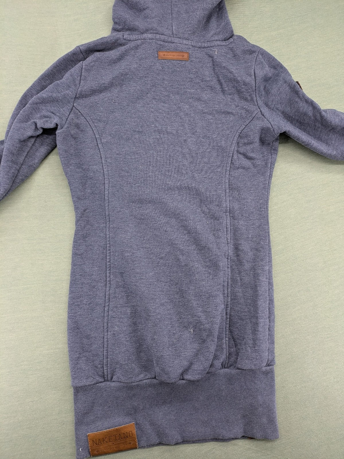 Naketano grey turtle neck jumper with thick drawstring and leather logo appliqué.
