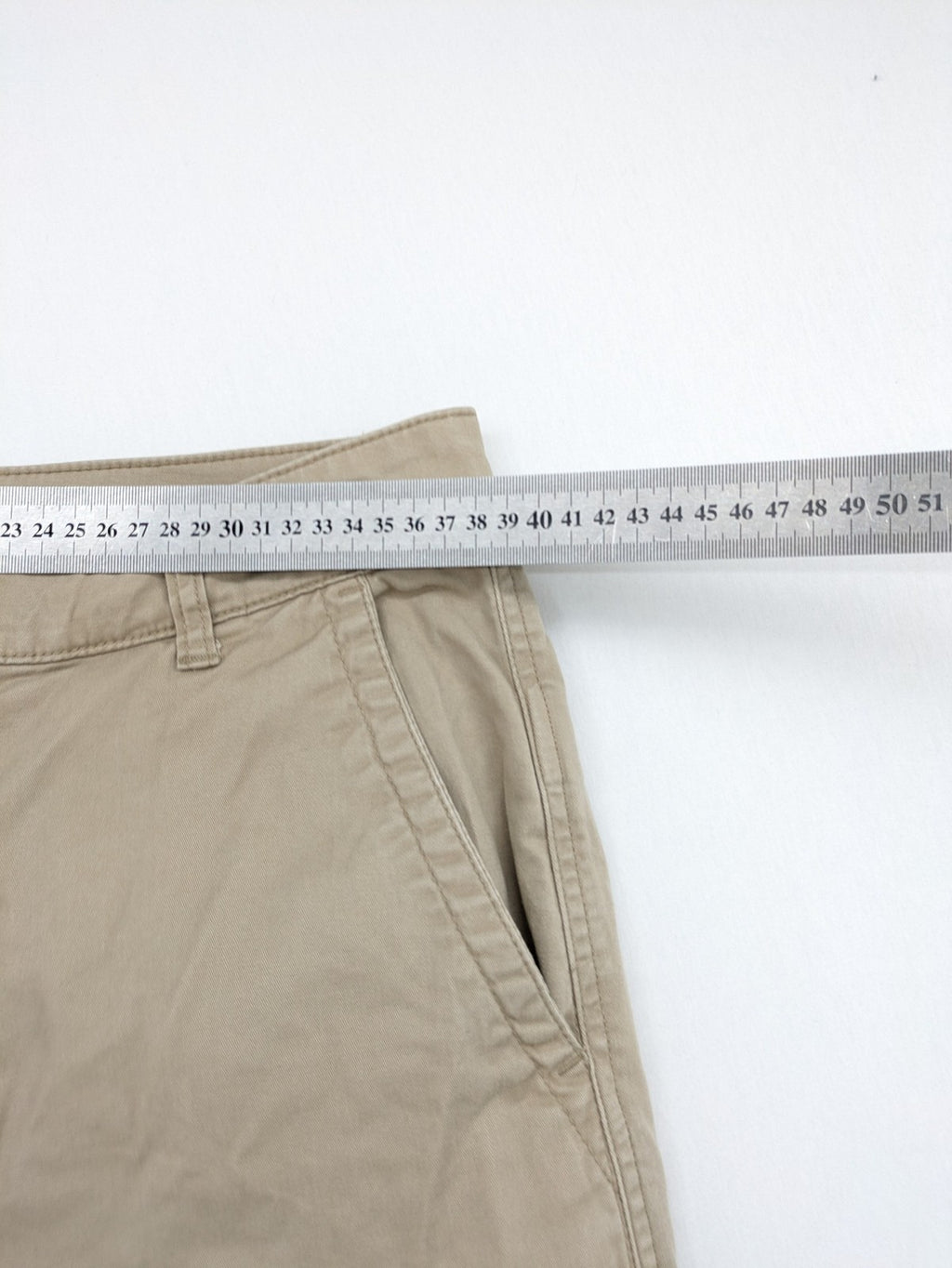 Gap beige girlfriend chino pants with relaxed fit and soft cotton-stretch blend.