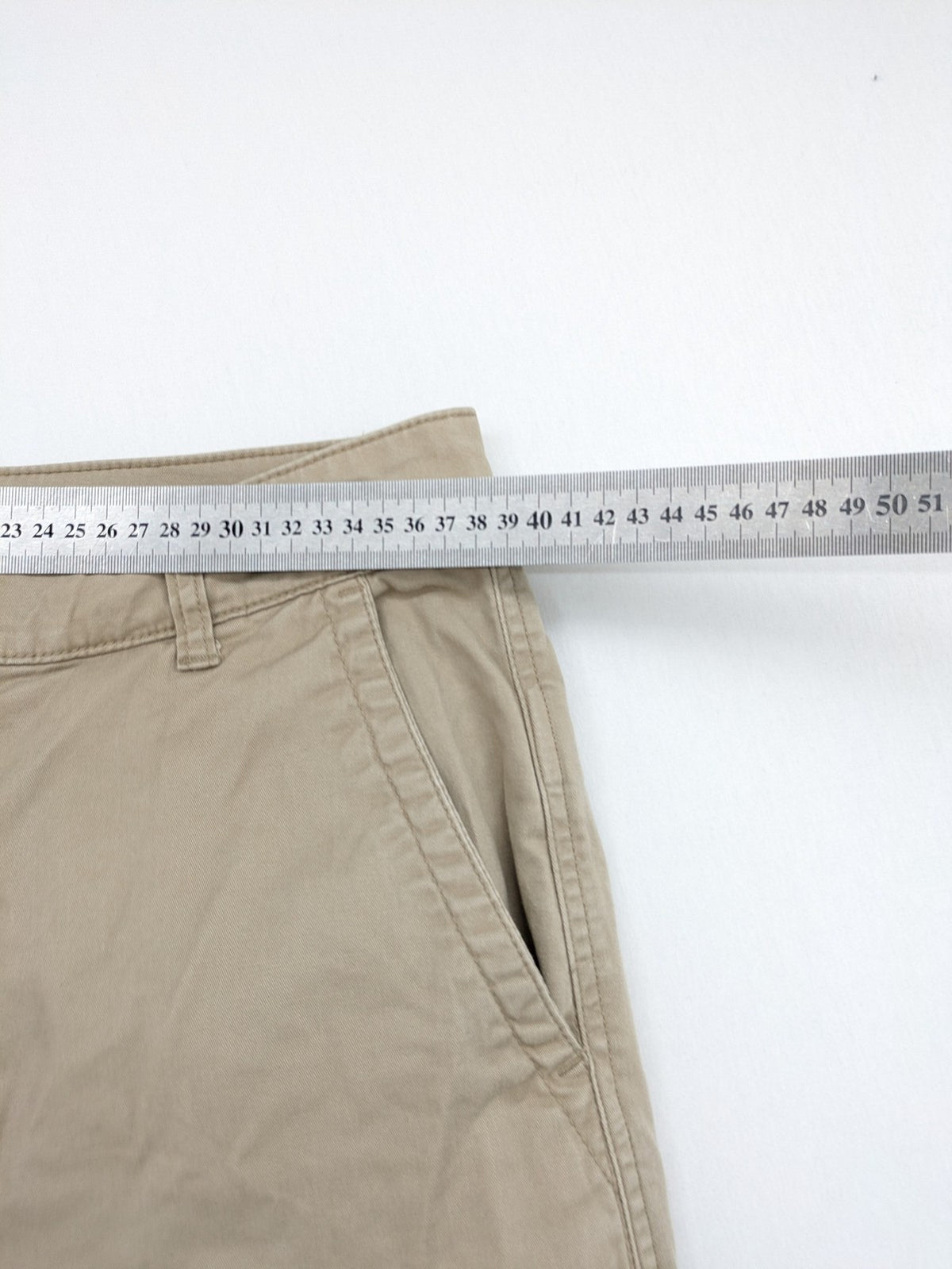 Gap beige girlfriend chino pants with relaxed fit and soft cotton-stretch blend.