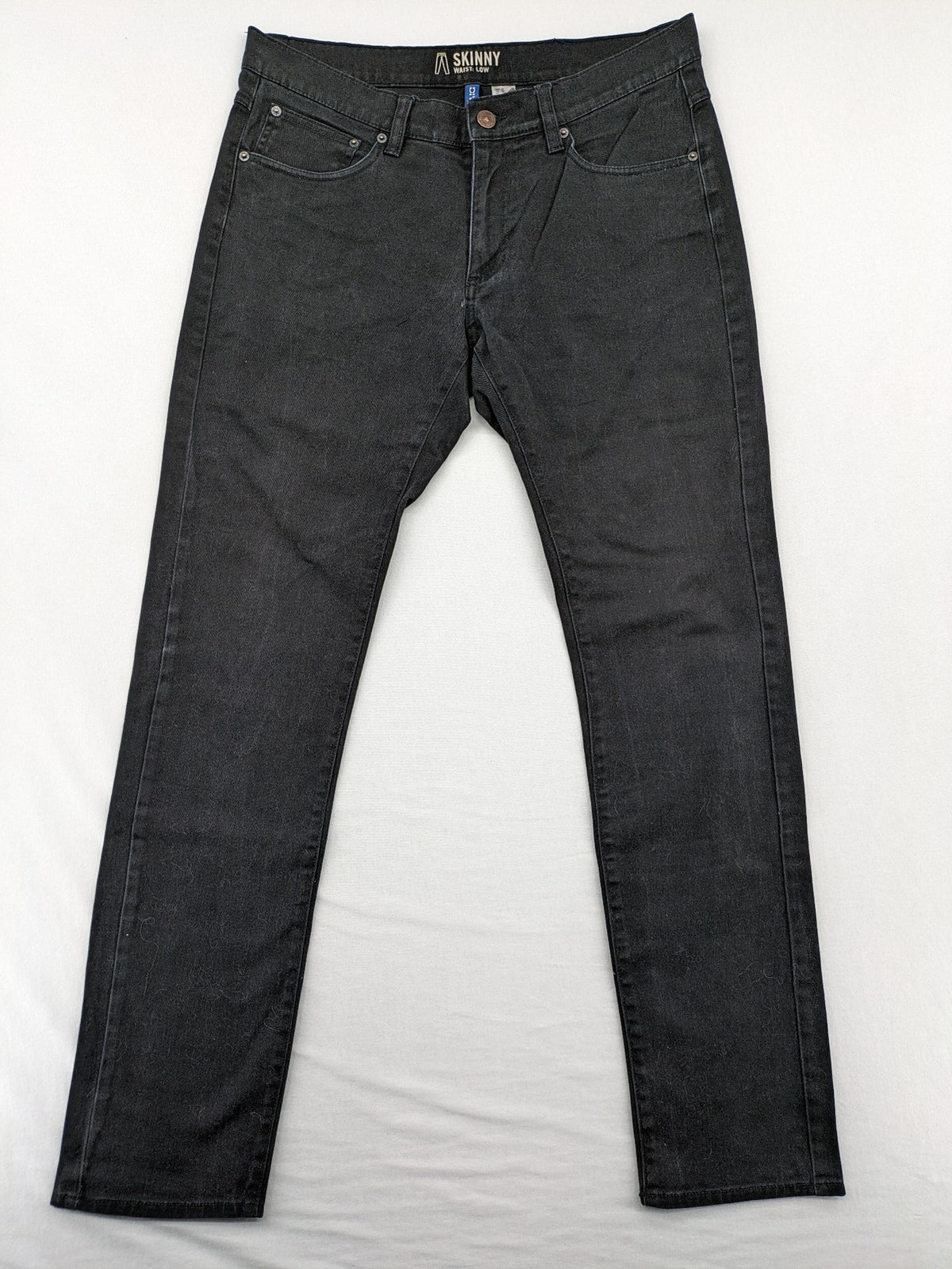 H&M Divided black skinny jeans low waist 5-pocket style with stretch denim material.