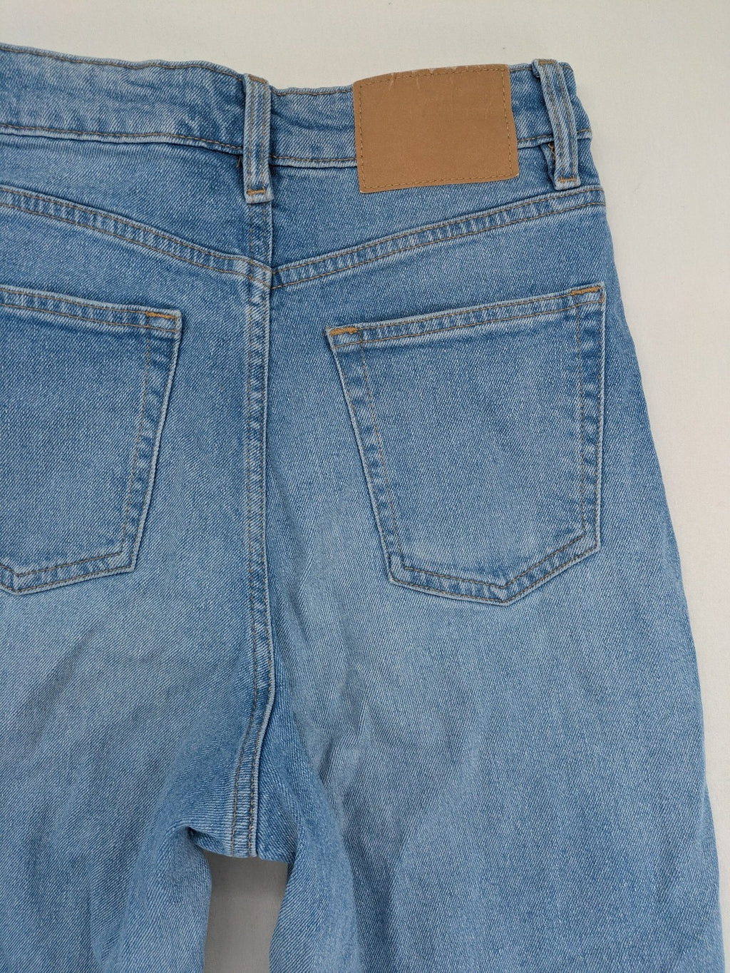 H&M Divided blue mom jeans high waist tapered fit with classic wash and durable cotton blend.