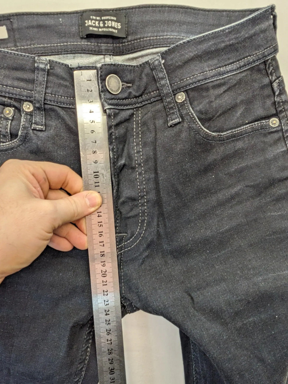 Jack & Jones grey slim fit jeans with classic 5-pocket style and button closure.