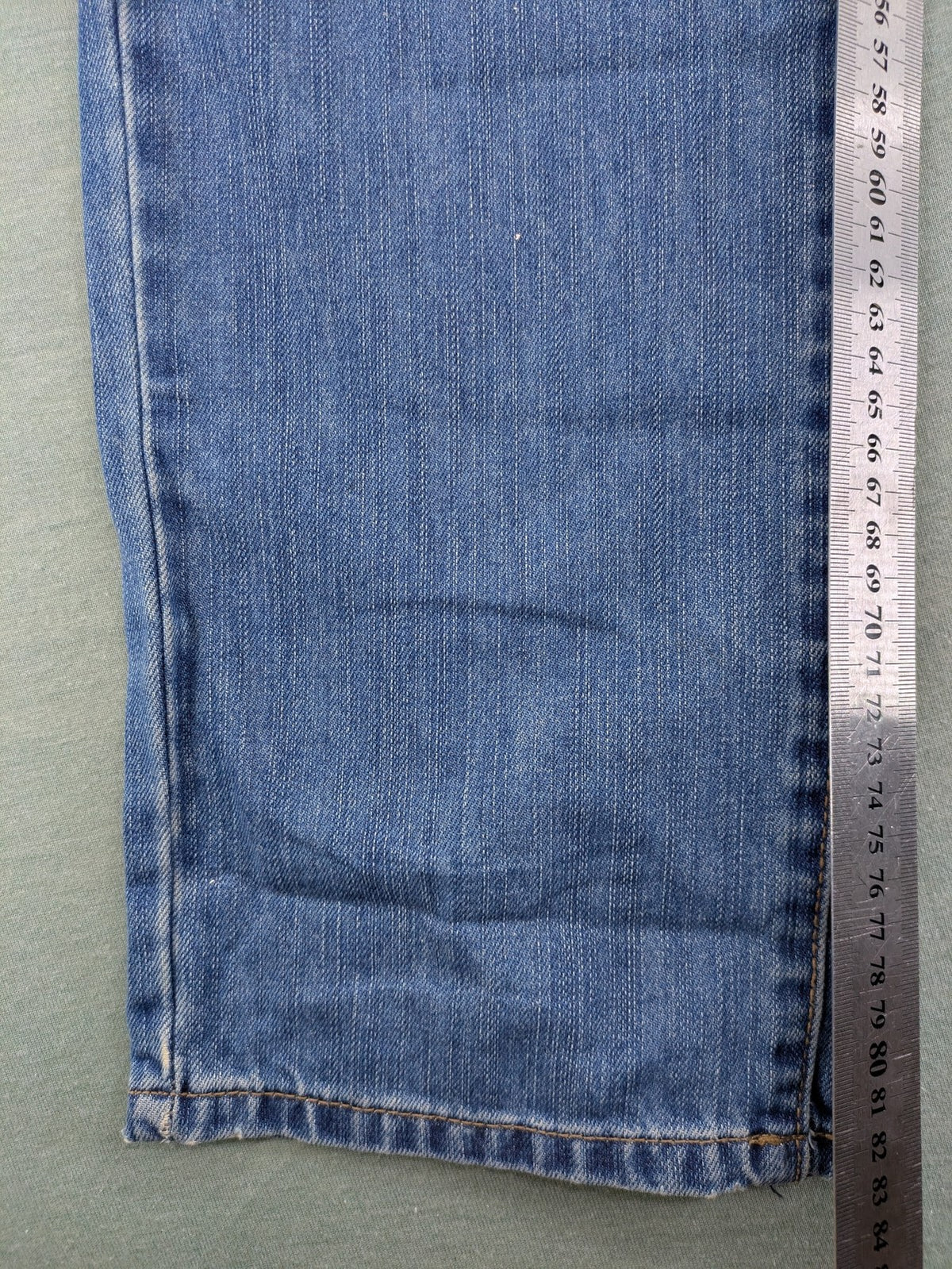 Benetton Jeans blue straight leg denim with button fly and classic design.