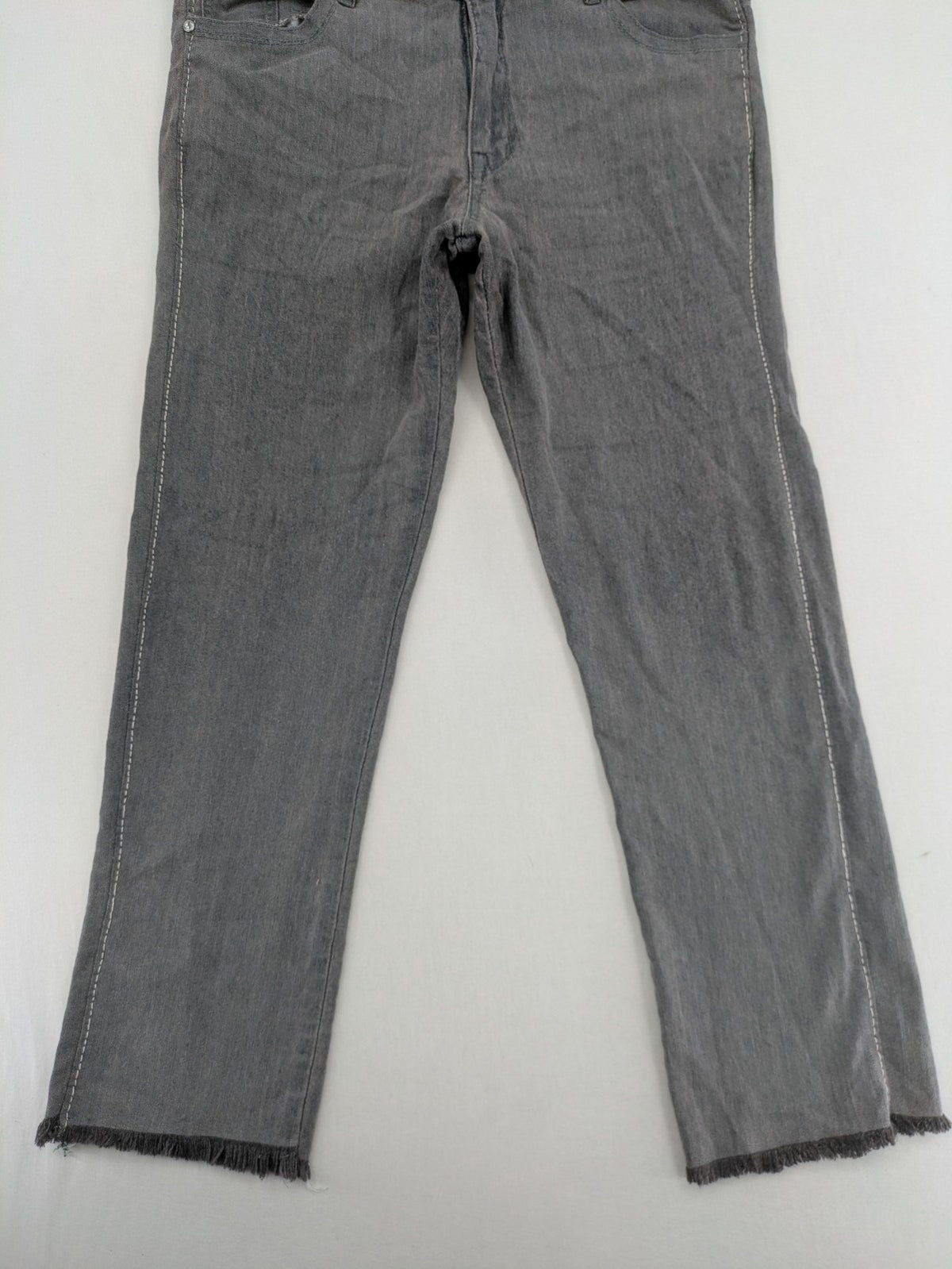 Jet Line grey straight jeans with embellished back pockets and frayed hem details.