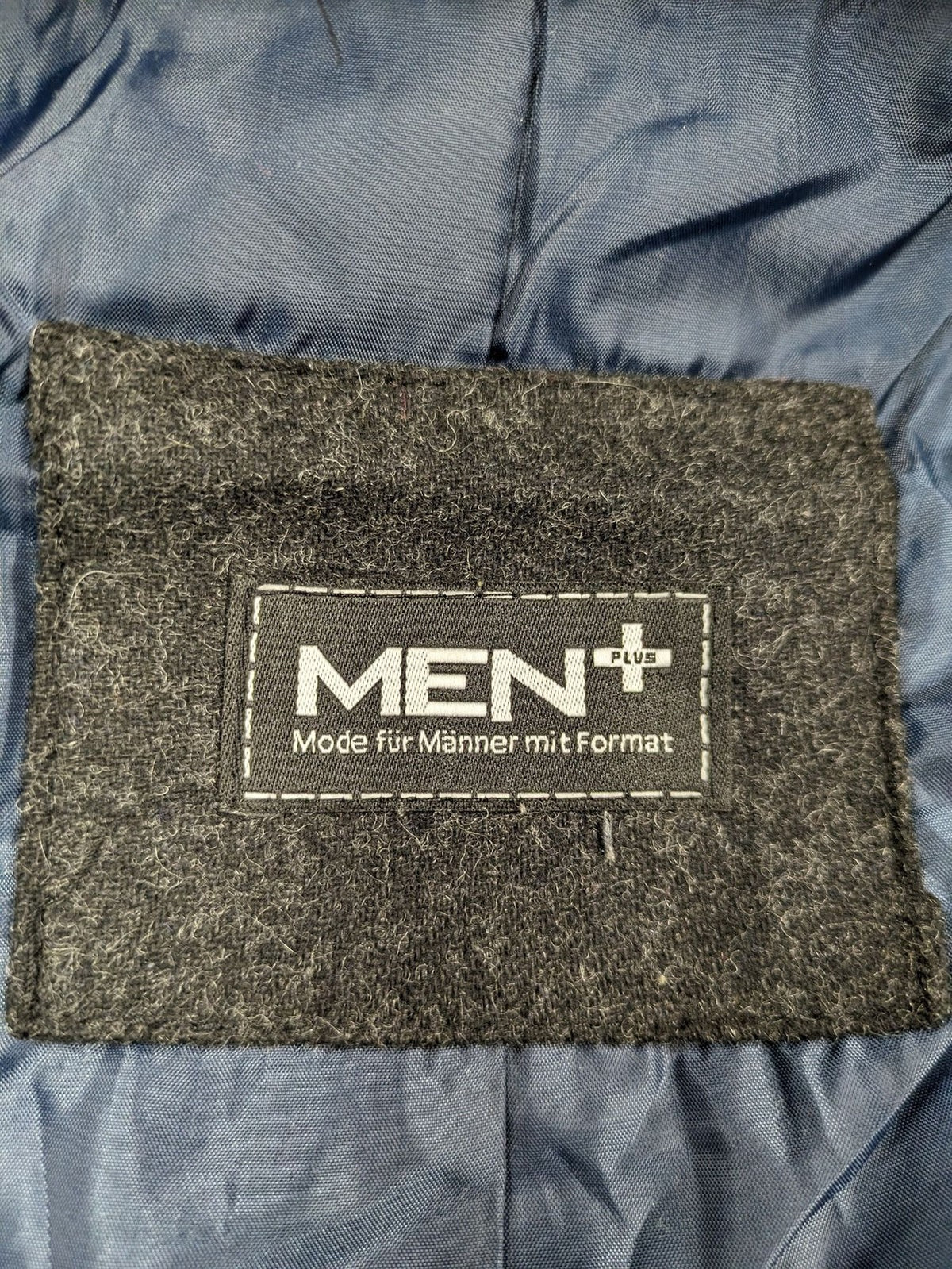 Men Plus grey and navy quilted vest with full zip and snap button placket.