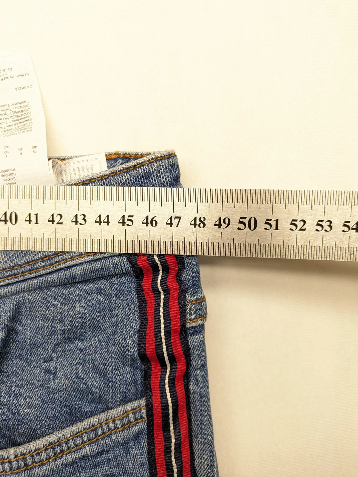 s.Oliver blue straight jeans with red and white side stripes, soft cotton blend material