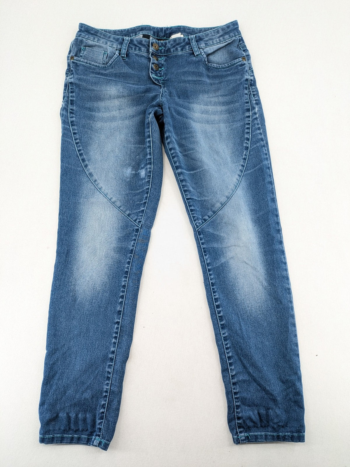 Rainbow blue straight jeans jogger style with button fly and contrasting turquoise stitching.
